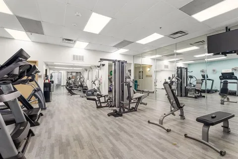 a view of a backyard with sitting area
