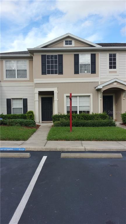 5841 Fishhawk Ridge Drive Lithia, FL 33547 - Photo 1 of 1 Front view, assigned parking and visitors' parking space.