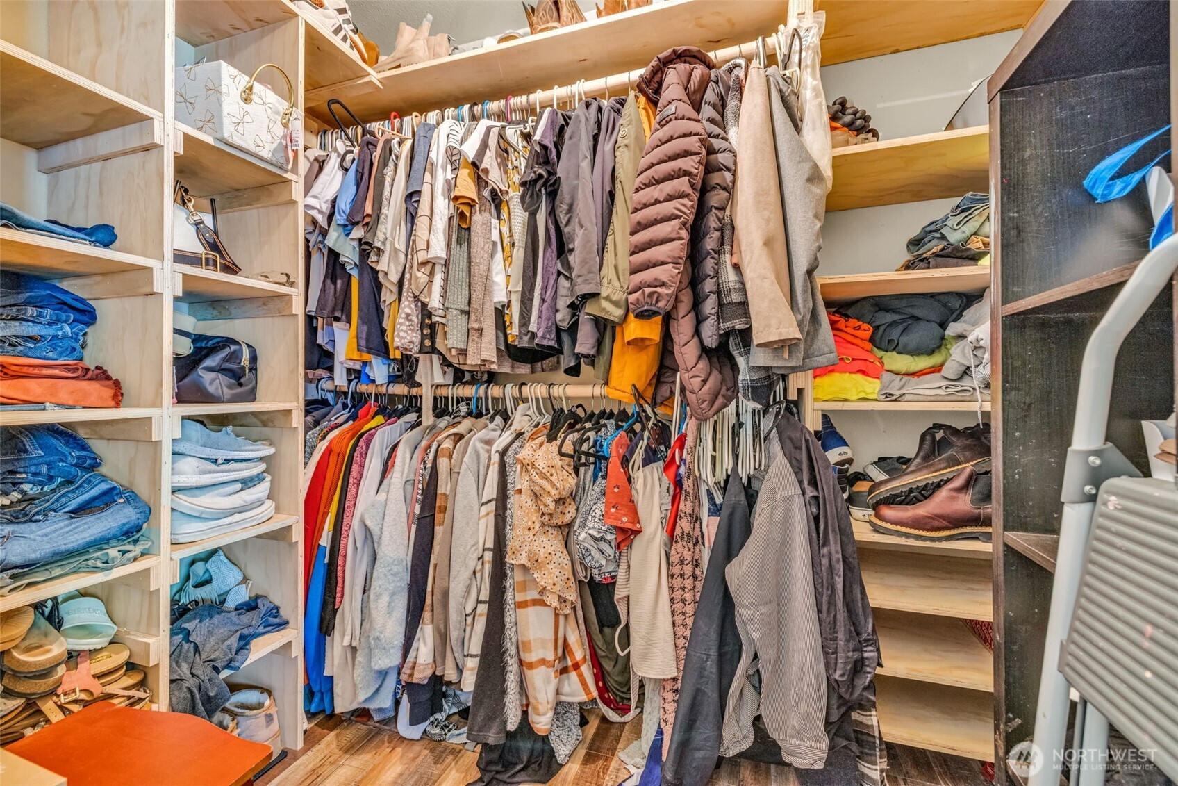 10313 School Land Road Southwest Rochester, WA 98579 - Photo 24 of 40 a view of walk in closet with clothes and shoes