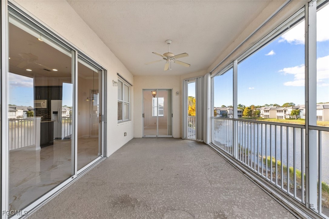 3520 Lansing Loop, Unit 203 Estero, FL 33928 - Photo 11 of 34 a view of a hallway with wooden cabinet and a window