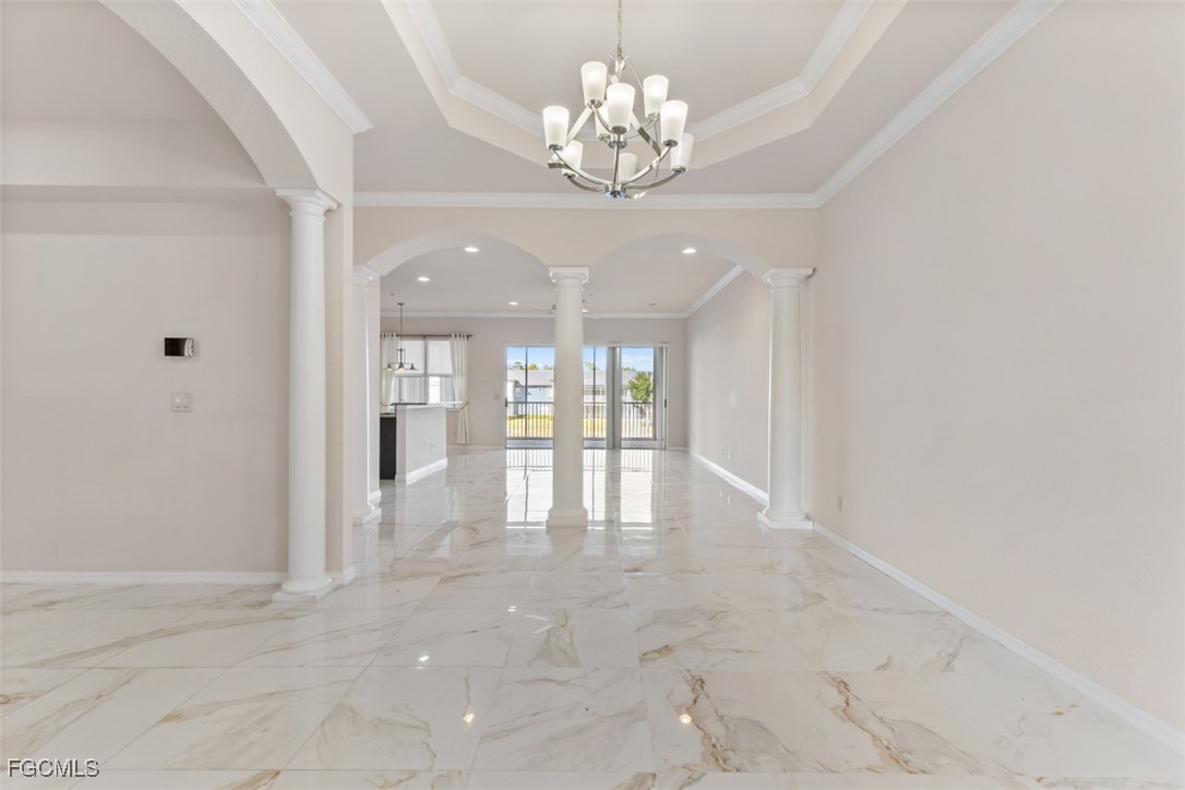 3520 Lansing Loop, Unit 203 Estero, FL 33928 - Photo 17 of 34 a view of an empty room with a chandelier