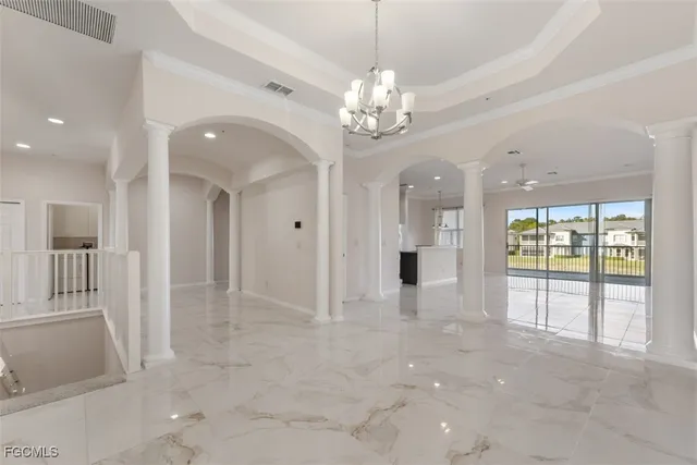 a view of an empty room with a fireplace