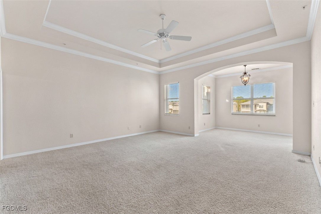 3520 Lansing Loop, Unit 203 Estero, FL 33928 - Photo 20 of 34 an empty room with windows and ceiling fan