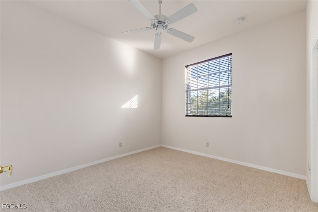 3520 Lansing Loop, Unit 203 Estero, FL 33928 - Photo 25 of 34 an empty room with windows and fan