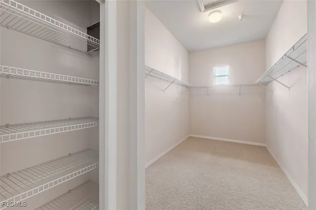 a view of an empty walk in closet