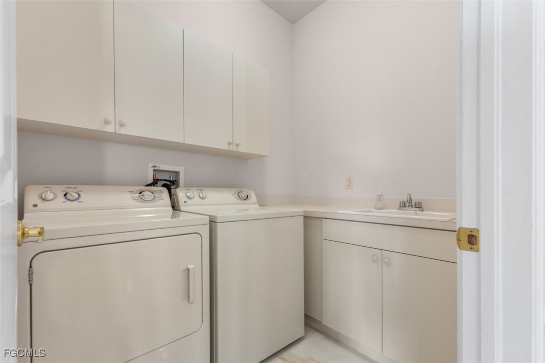3520 Lansing Loop, Unit 203 Estero, FL 33928 - Photo 27 of 34 a utility room with dryer and washer