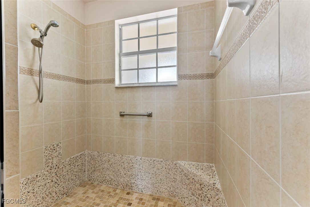 3520 Lansing Loop, Unit 203 Estero, FL 33928 - Photo 29 of 34 a bathroom with a shower