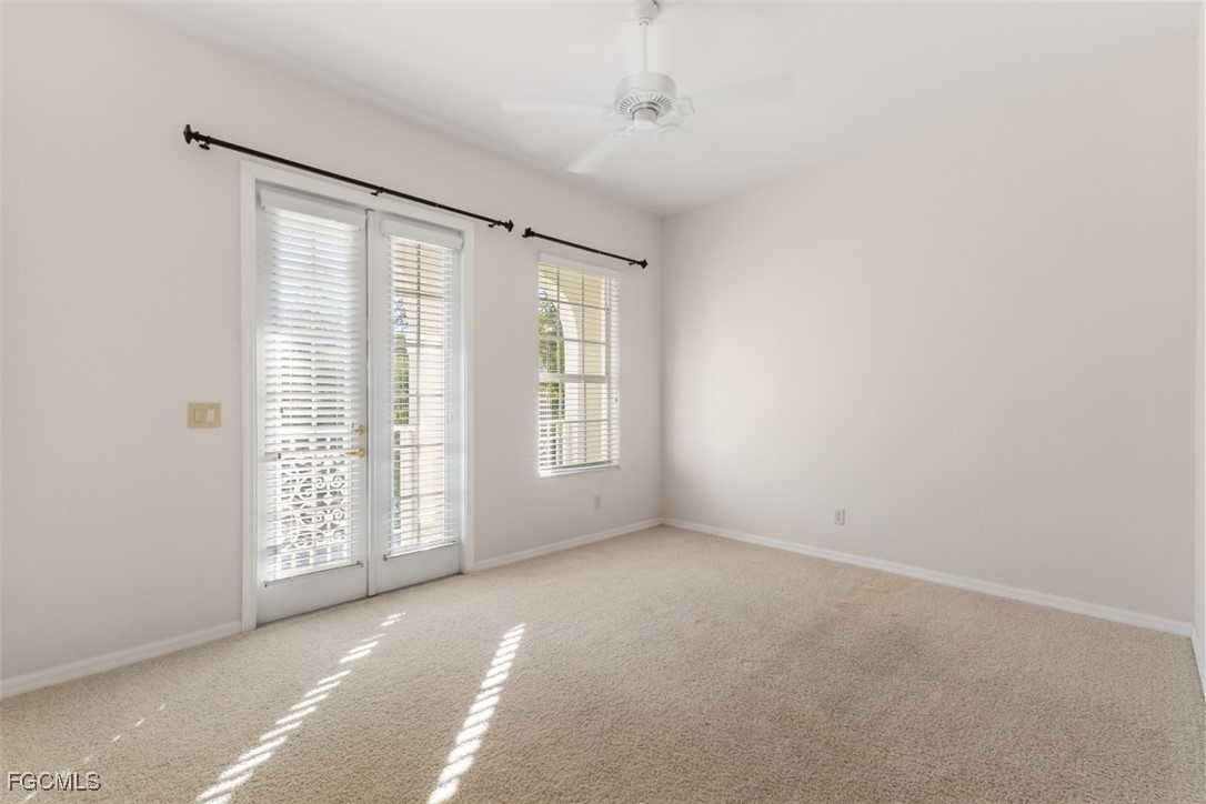 3520 Lansing Loop, Unit 203 Estero, FL 33928 - Photo 32 of 34 a view of an empty room with a window
