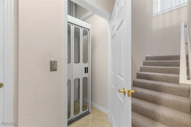 a view of staircase with white walls