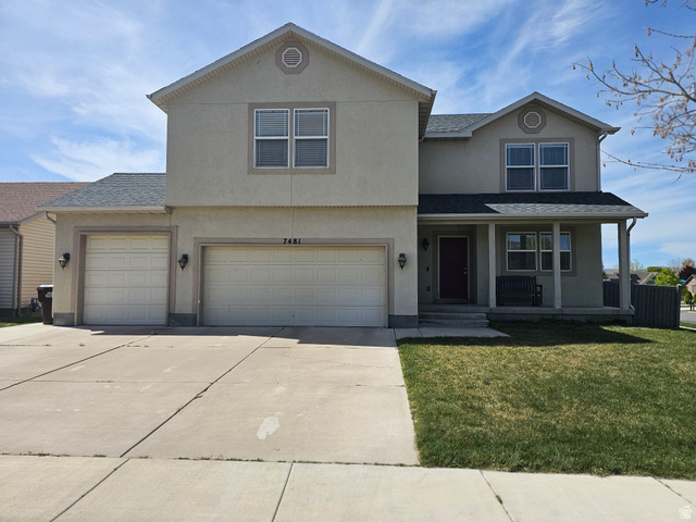 7481 Red Pine Road Eagle Mountain, UT 84005 - Photo 1 of 38 Two Story Property with a 3-Car garage.Stucco exterior with a covered porch entry