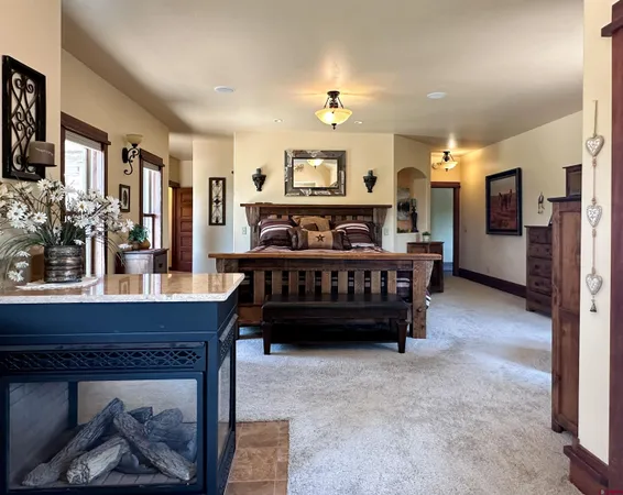 a bed room with furniture and a chandelier