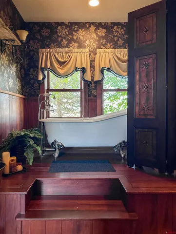 a room with potted plants and wooden floor