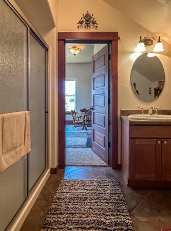 a bedroom with a bed and a view of bathroom