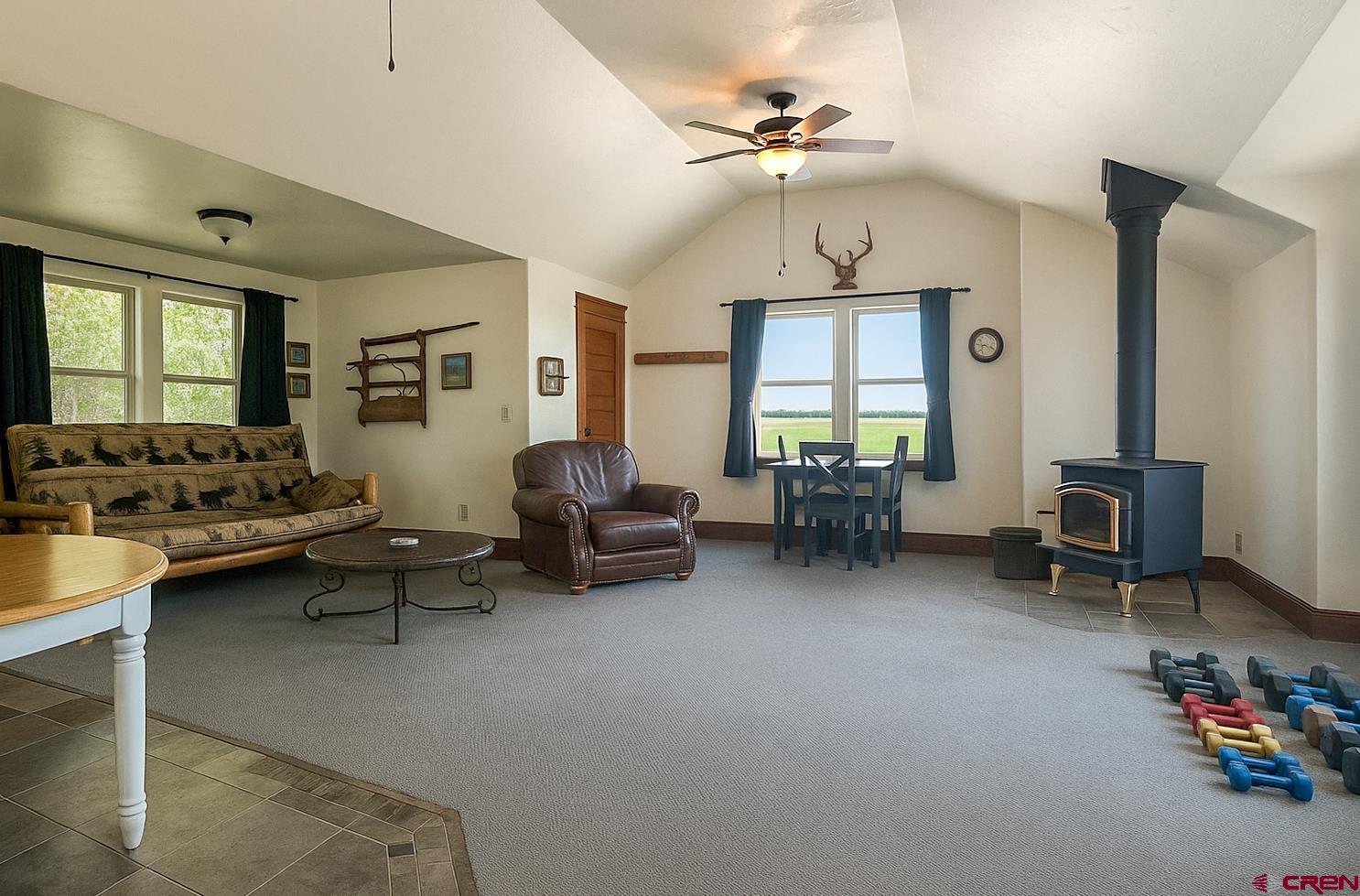 7276 5550th Road Olathe, CO 81425 - Photo 28 of 45 a living room with furniture and a window