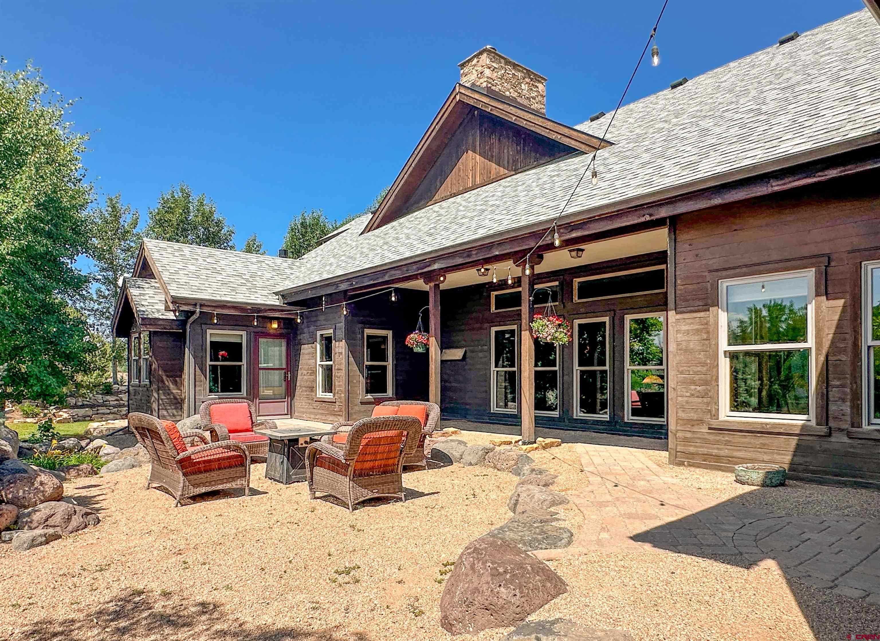 7276 5550th Road Olathe, CO 81425 - Photo 30 of 45 a view of a house with a patio