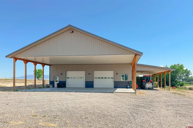 a aerial view of a house with a yard