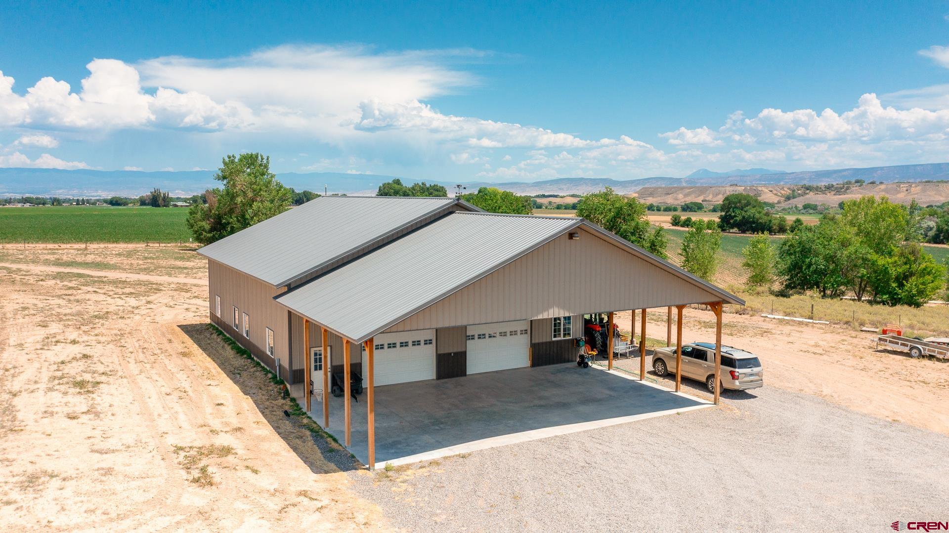 7276 5550th Road Olathe, CO 81425 - Photo 35 of 45 a aerial view of a house with a yard