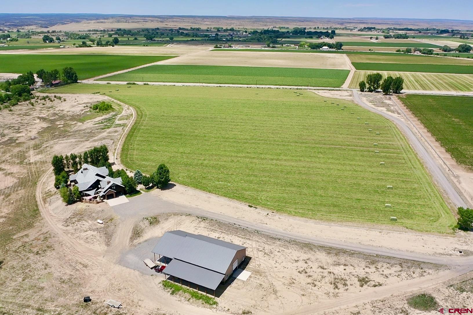 7276 5550th Road Olathe, CO 81425 - Photo 41 of 45 a view of a swimming pool with a yard
