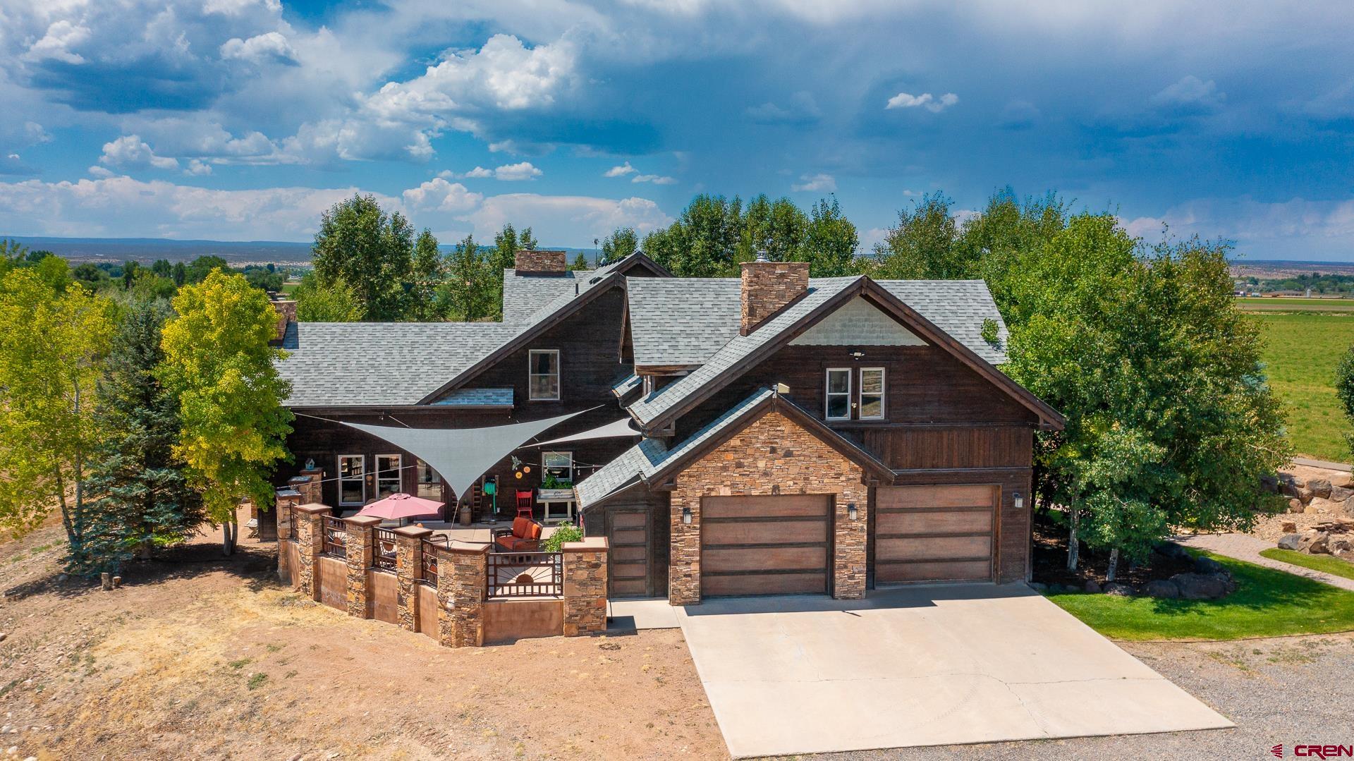 7276 5550th Road Olathe, CO 81425 - Photo 42 of 45 a view of house with outdoor seating yard and green space