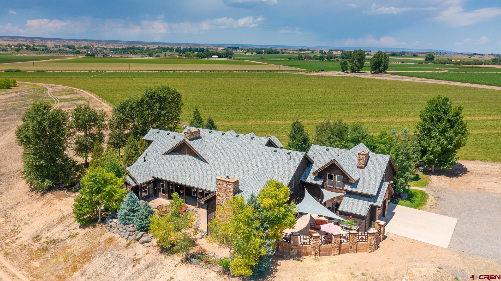 7276 5550th Road Olathe, CO 81425 - Photo 44 of 45 an aerial view of a residential houses with outdoor space and ocean view