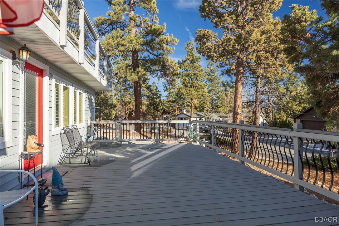 39388 Lodge Road Fawnskin, CA 92333 - Photo 12 of 45 a view of a balcony with chairs