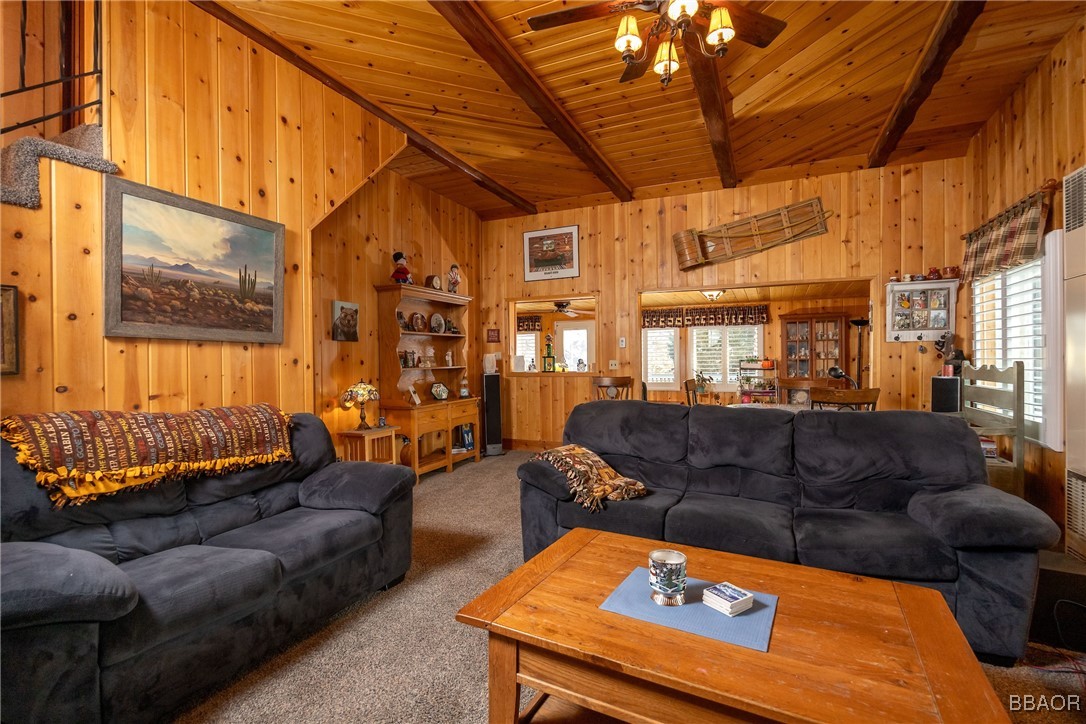 39388 Lodge Road Fawnskin, CA 92333 - Photo 18 of 45 a living room with furniture and a flat screen tv