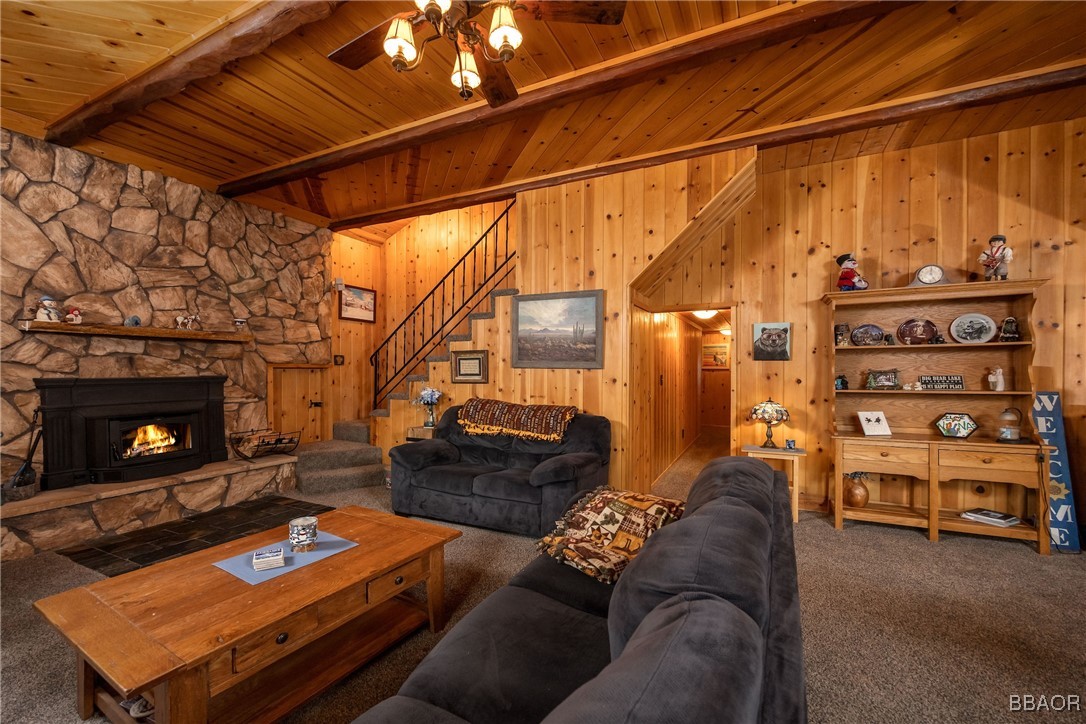 39388 Lodge Road Fawnskin, CA 92333 - Photo 20 of 45 a living room with furniture and a fireplace