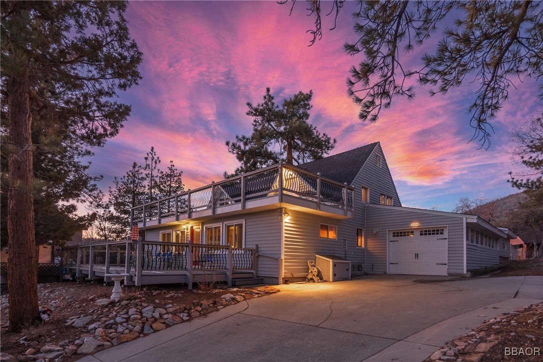 39388 Lodge Road Fawnskin, CA 92333 - Photo 2 of 45 a front view of a house with a yard and tree s