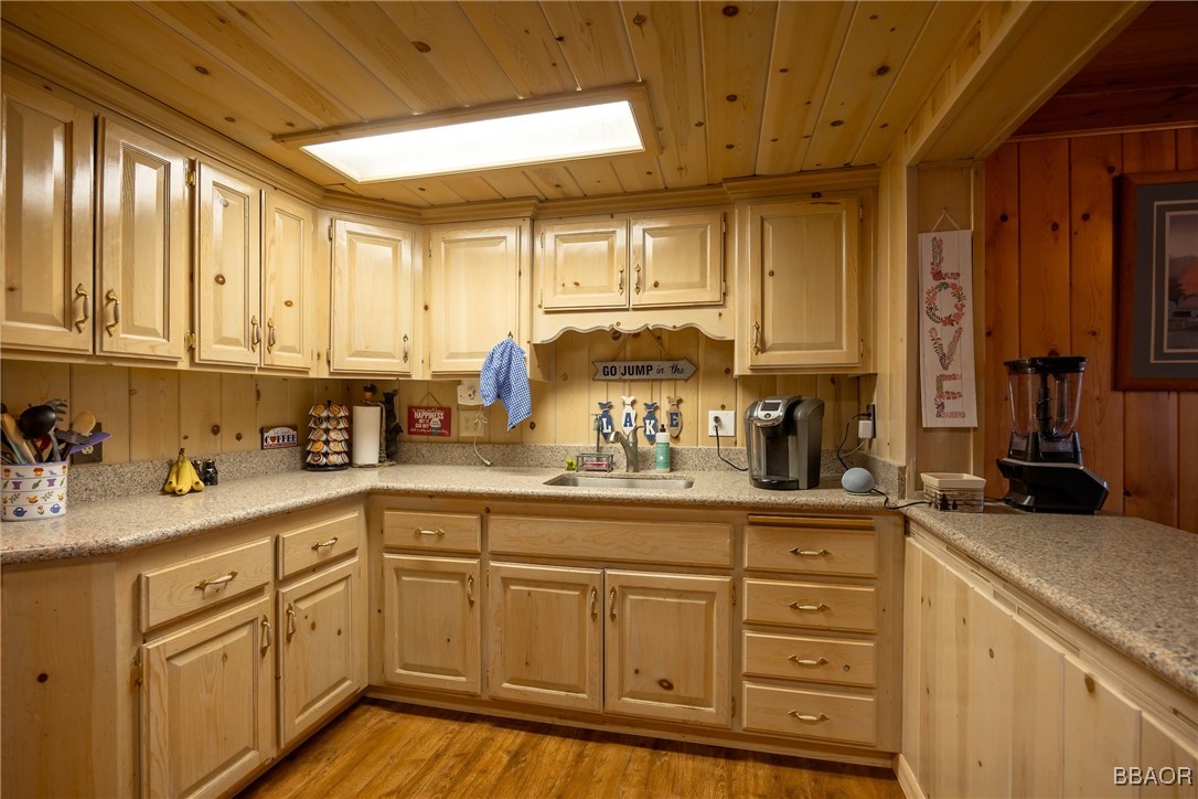 39388 Lodge Road Fawnskin, CA 92333 - Photo 26 of 45 a kitchen with sink cabinets and window