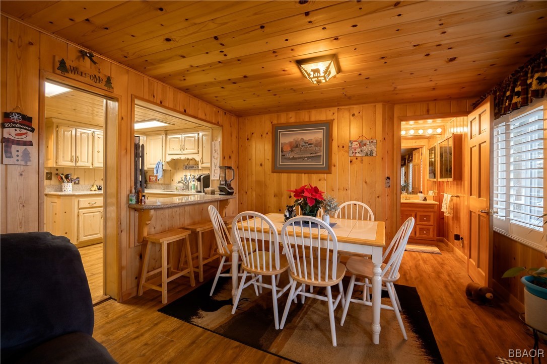 39388 Lodge Road Fawnskin, CA 92333 - Photo 28 of 45 a view of a dining room with furniture and wooden floor