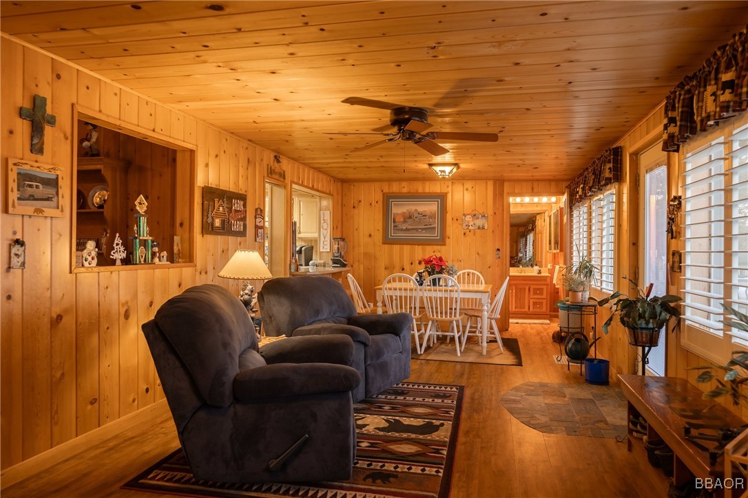 39388 Lodge Road Fawnskin, CA 92333 - Photo 31 of 45 a media room with lots of chairs and a chandelier