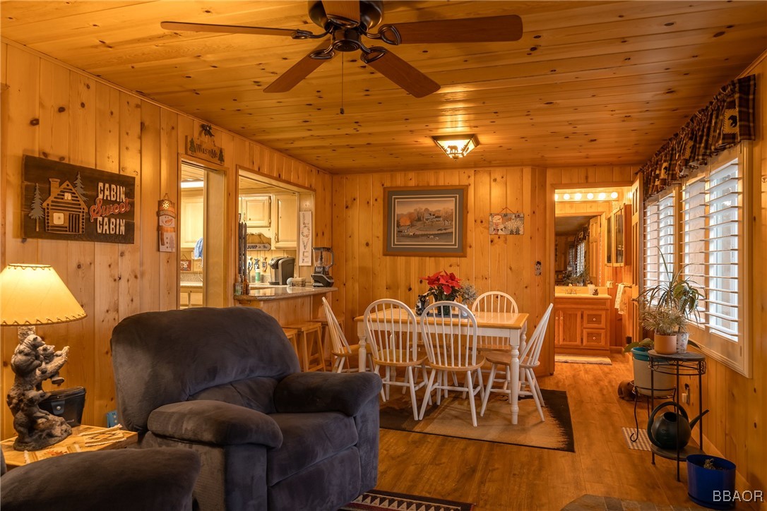 39388 Lodge Road Fawnskin, CA 92333 - Photo 32 of 45 a dining room with furniture and wooden floor