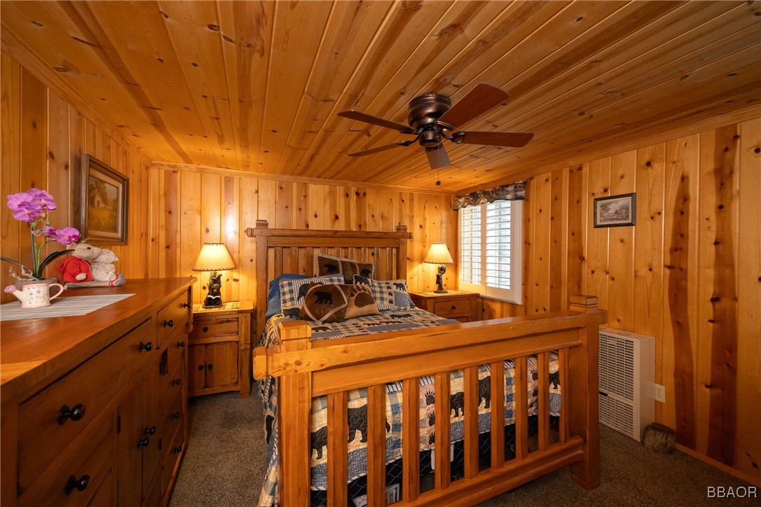 39388 Lodge Road Fawnskin, CA 92333 - Photo 35 of 45 a bedroom with furniture and a window