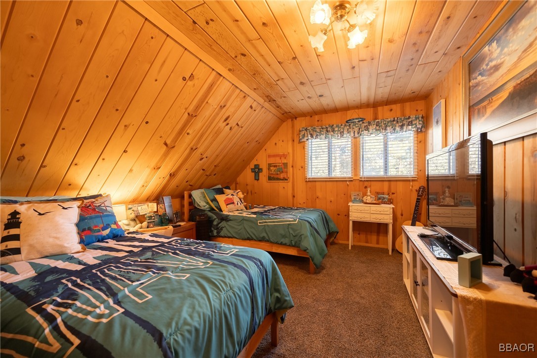 39388 Lodge Road Fawnskin, CA 92333 - Photo 39 of 45 a bed room with two bed and a chair