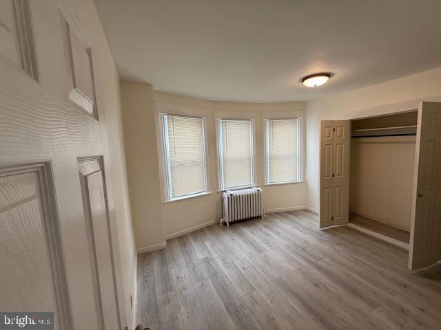 216 South 7th Street Darby, PA 19023 - Photo 12 of 46 a view of an empty room with wooden floor and a window