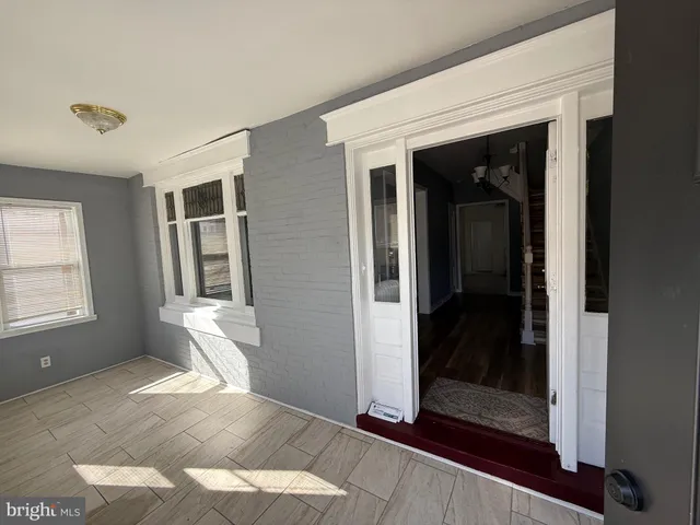 a kitchen with granite countertop a refrigerator and a sink