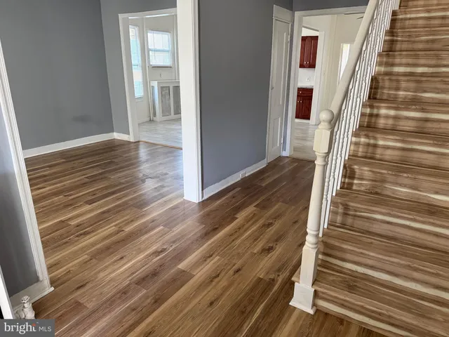 a kitchen with stainless steel appliances granite countertop a refrigerator sink and cabinets