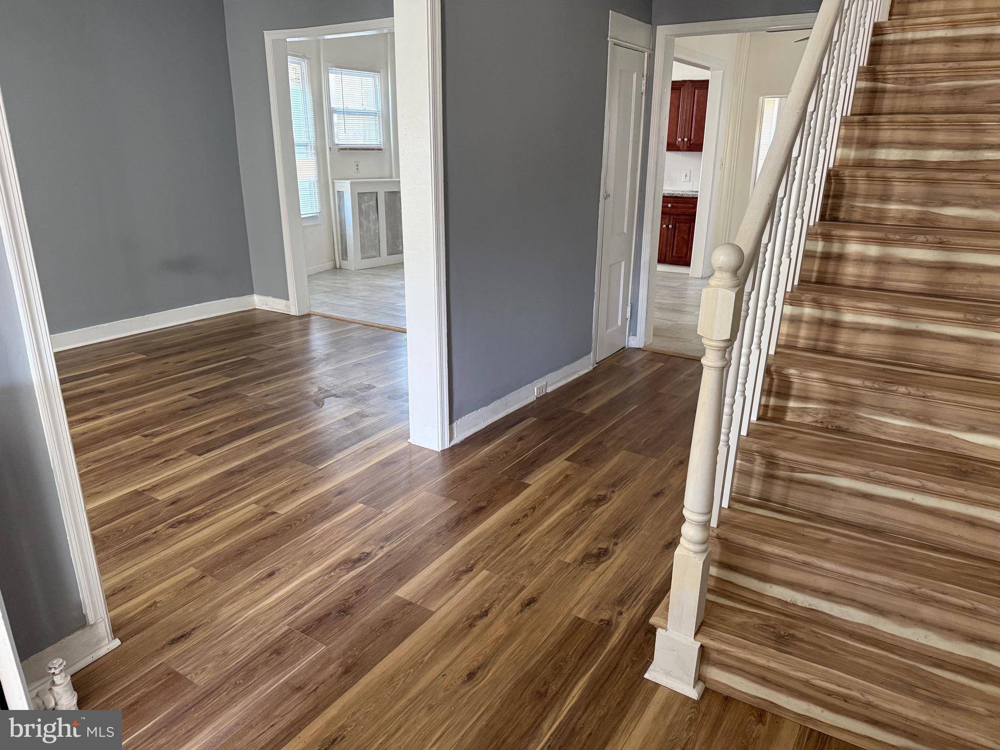 216 South 7th Street Darby, PA 19023 - Photo 24 of 46 a view of a hallway with wooden floor and staircase