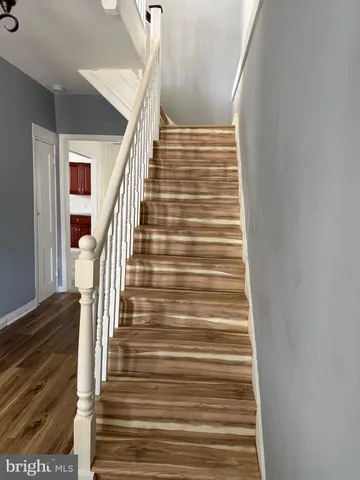 a kitchen with granite countertop stainless steel appliances a stove a sink and dishwasher