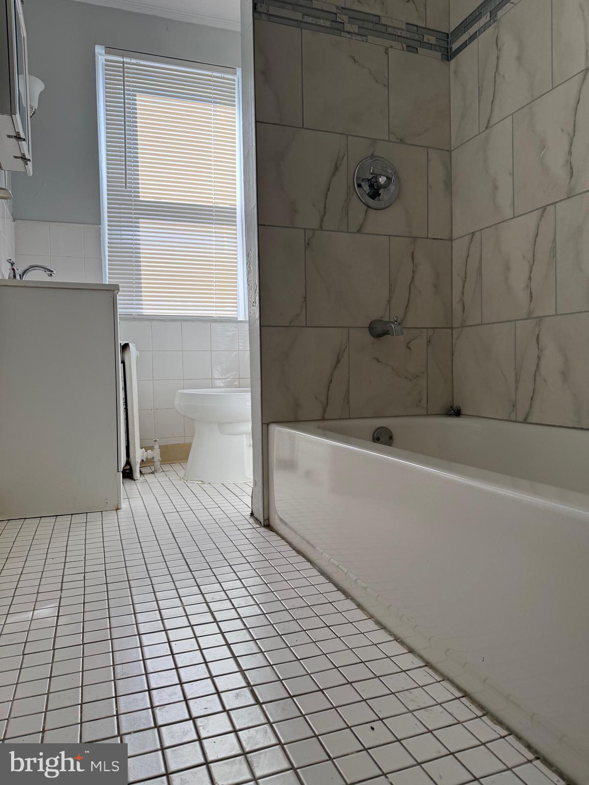 216 South 7th Street Darby, PA 19023 - Photo 30 of 46 a bathroom with a sink a toilet and a bathtub