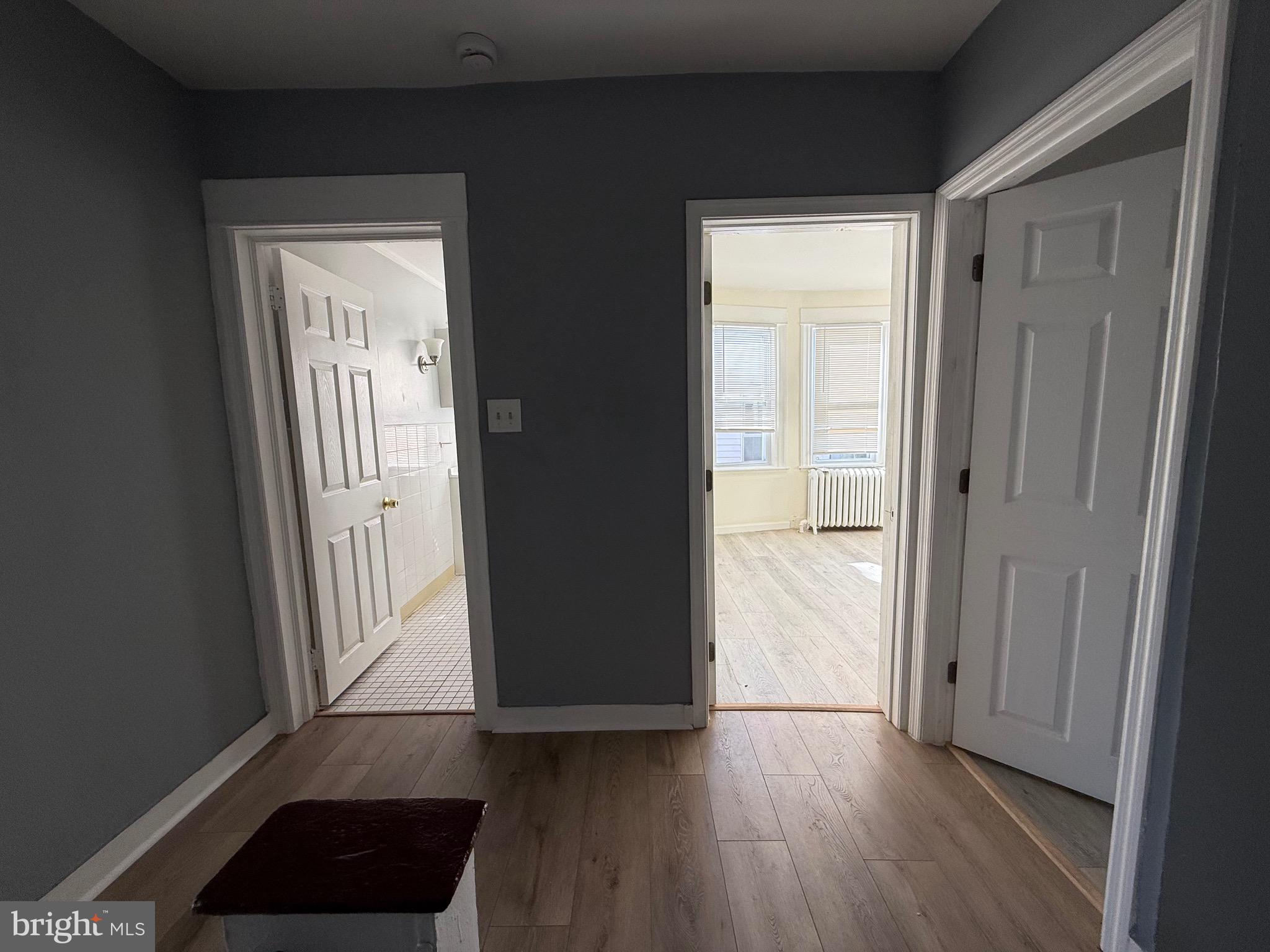 216 South 7th Street Darby, PA 19023 - Photo 35 of 46 a view of a hallway with wooden floor and glass door