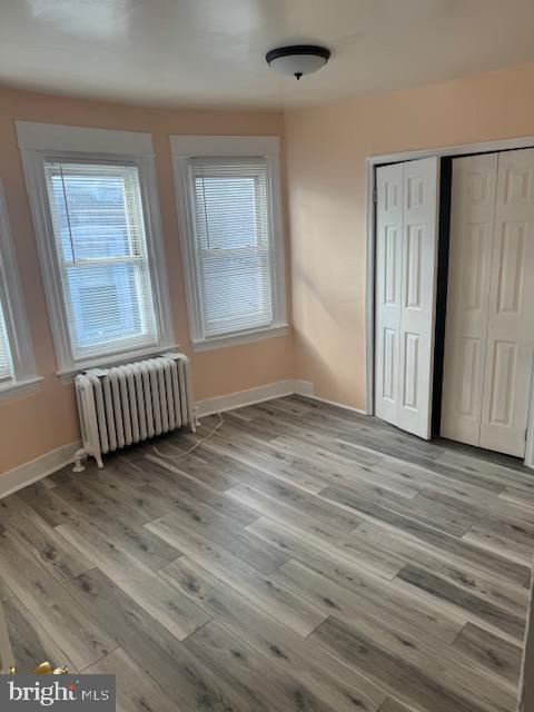 216 South 7th Street Darby, PA 19023 - Photo 4 of 46 an empty room with wooden floor and windows