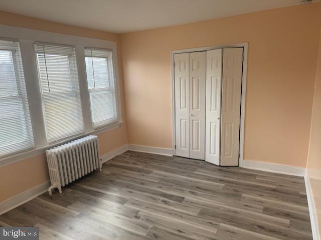 216 South 7th Street Darby, PA 19023 - Photo 5 of 46 an empty room with wooden floor and windows