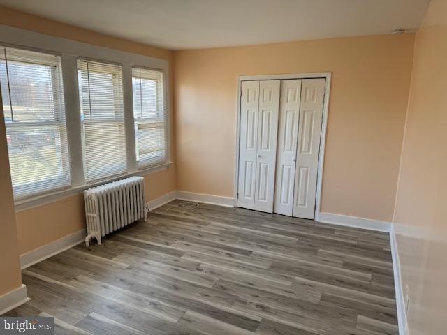 216 South 7th Street Darby, PA 19023 - Photo 6 of 46 a view of an empty room with wooden floor and a window