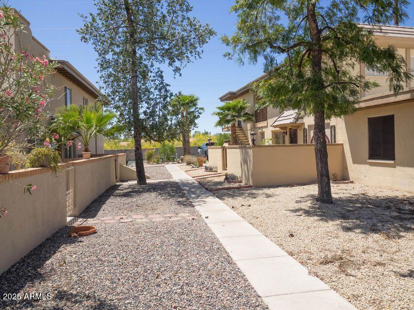 14806 Yerba Buena Way, Unit A Fountain Hills, AZ 85268 - Photo 6 of 16 a view of a house with a yard and tree