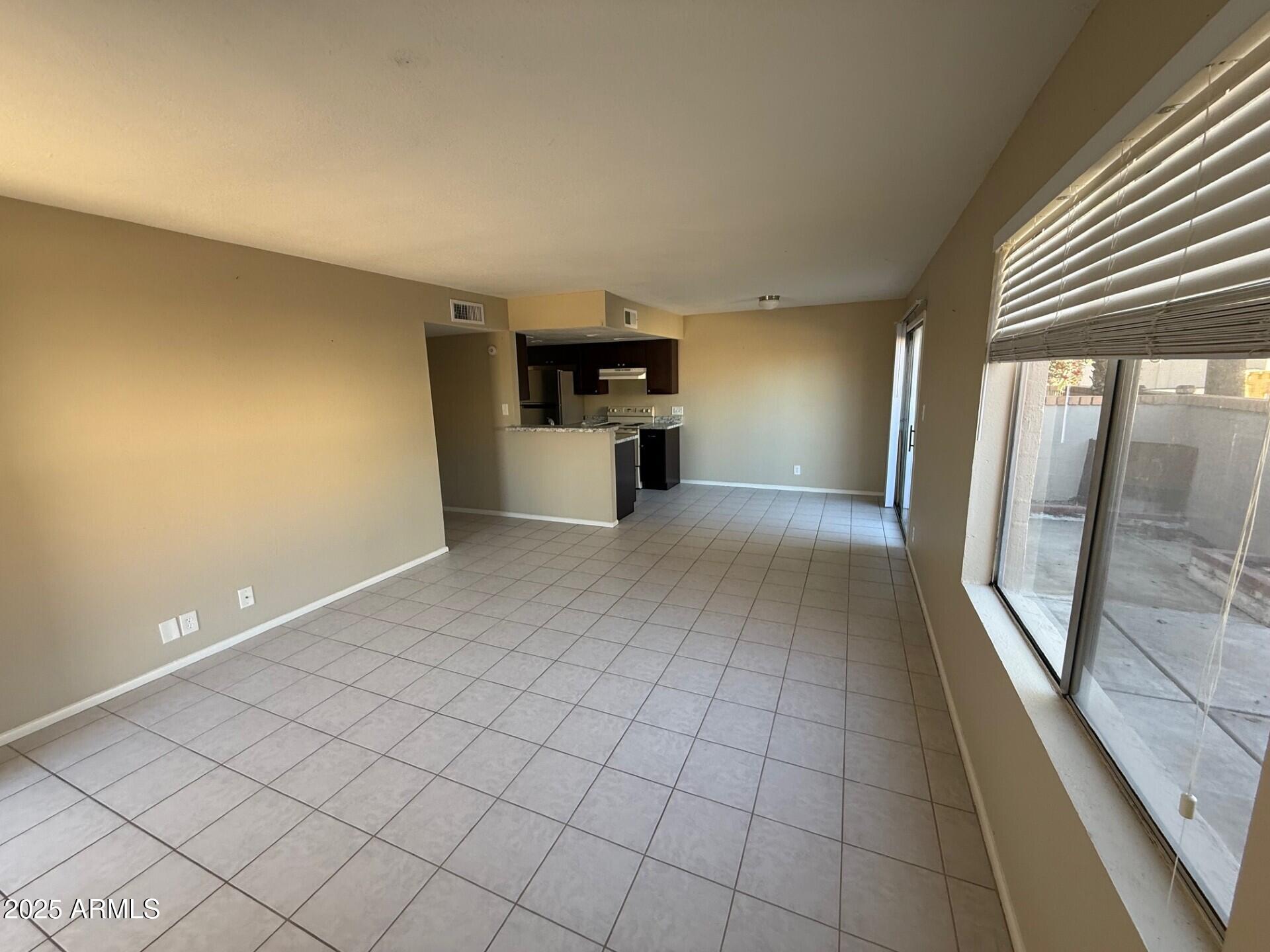 14806 Yerba Buena Way, Unit A Fountain Hills, AZ 85268 - Photo 7 of 16 a view of a big room with windows and chandelier