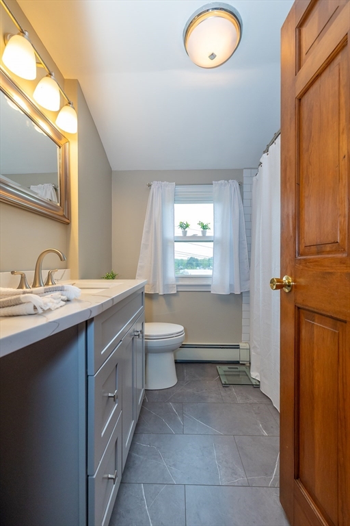 7 Adirondack Road Chelmsford, MA 01824 - Photo 16 of 31 a bathroom with a toilet sink and mirror