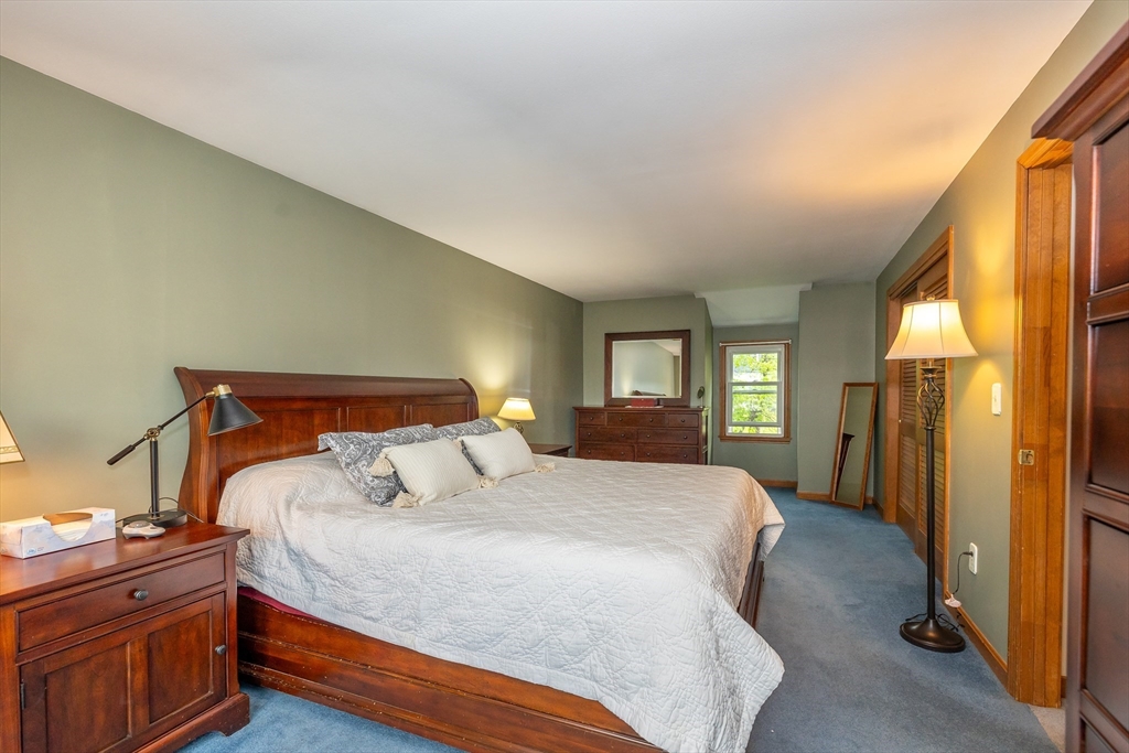 7 Adirondack Road Chelmsford, MA 01824 - Photo 17 of 31 a bedroom with a bed and a night stand