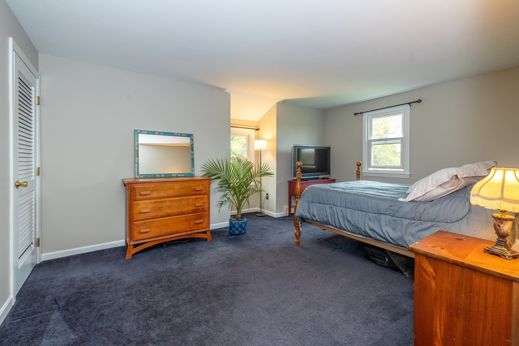 7 Adirondack Road Chelmsford, MA 01824 - Photo 19 of 31 a bedroom with a bed and a cabinets