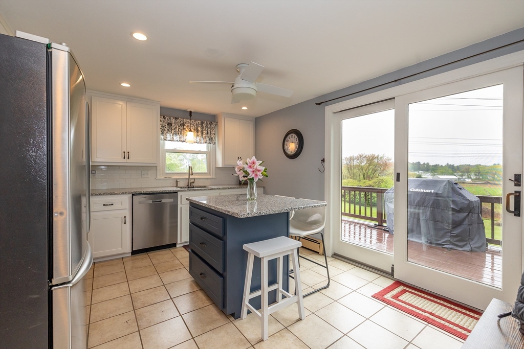 7 Adirondack Road Chelmsford, MA 01824 - Photo 2 of 31 a kitchen with a sink a counter top space and stainless steel appliances